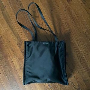Black Kate Spade bag.